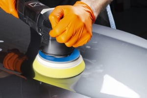 buffing out wax on a silver car