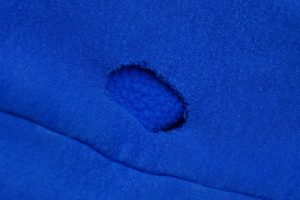 frayed and worn blue fabric